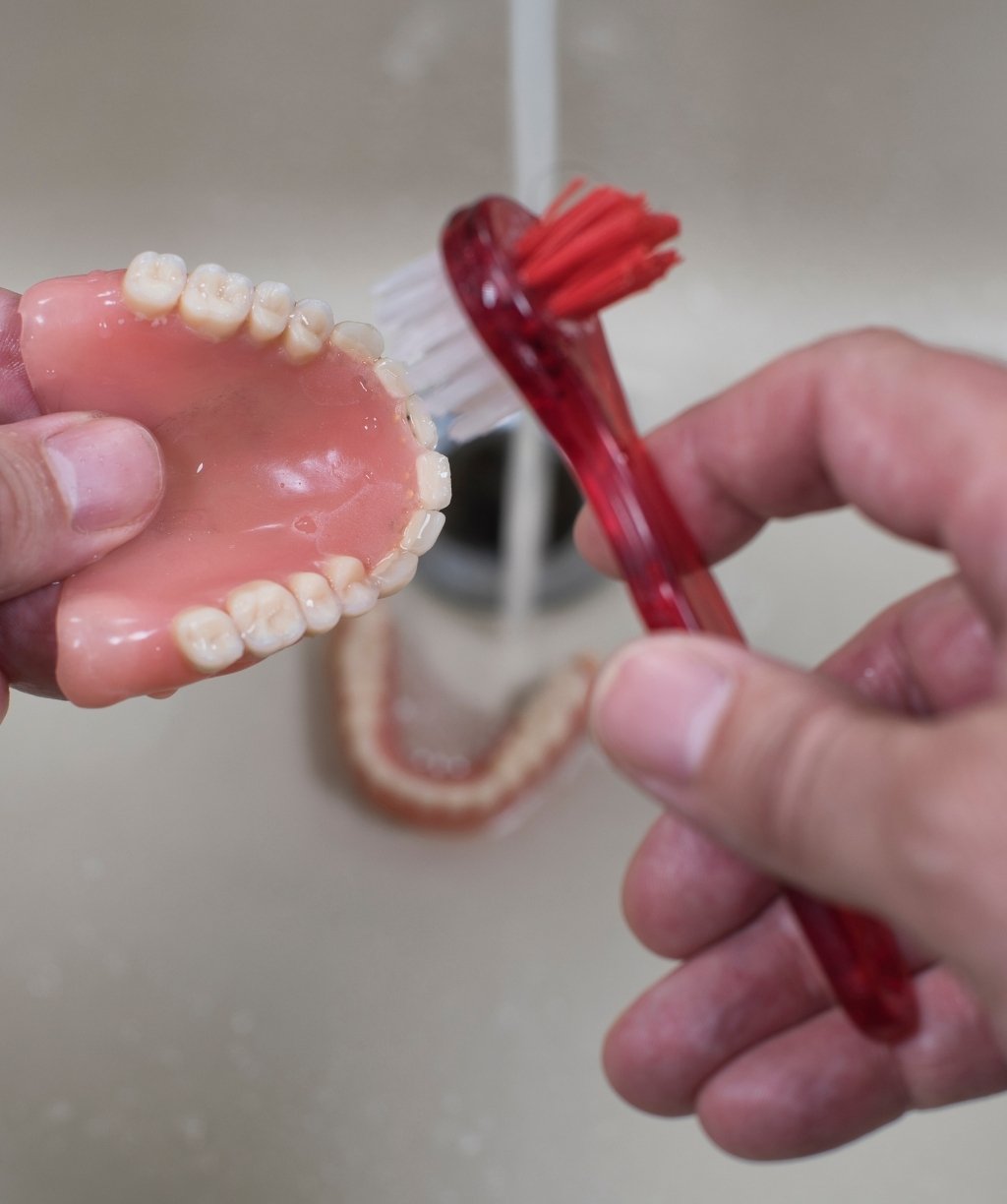 Mobile dental care provider assisting a patient at home