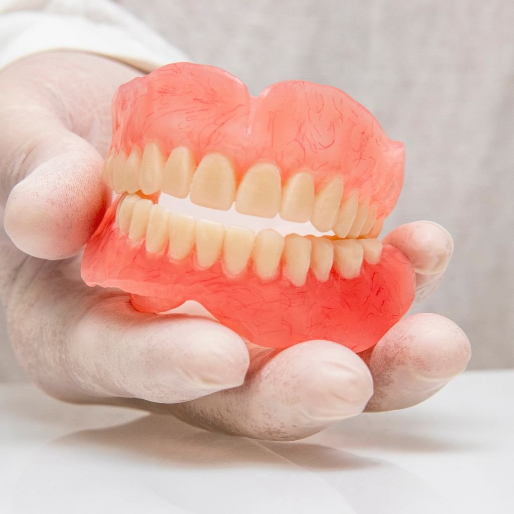 Dental hygienist providing periodontal care in a patient's home