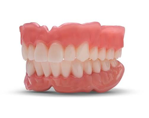 Professional denture cleaning service being carried out